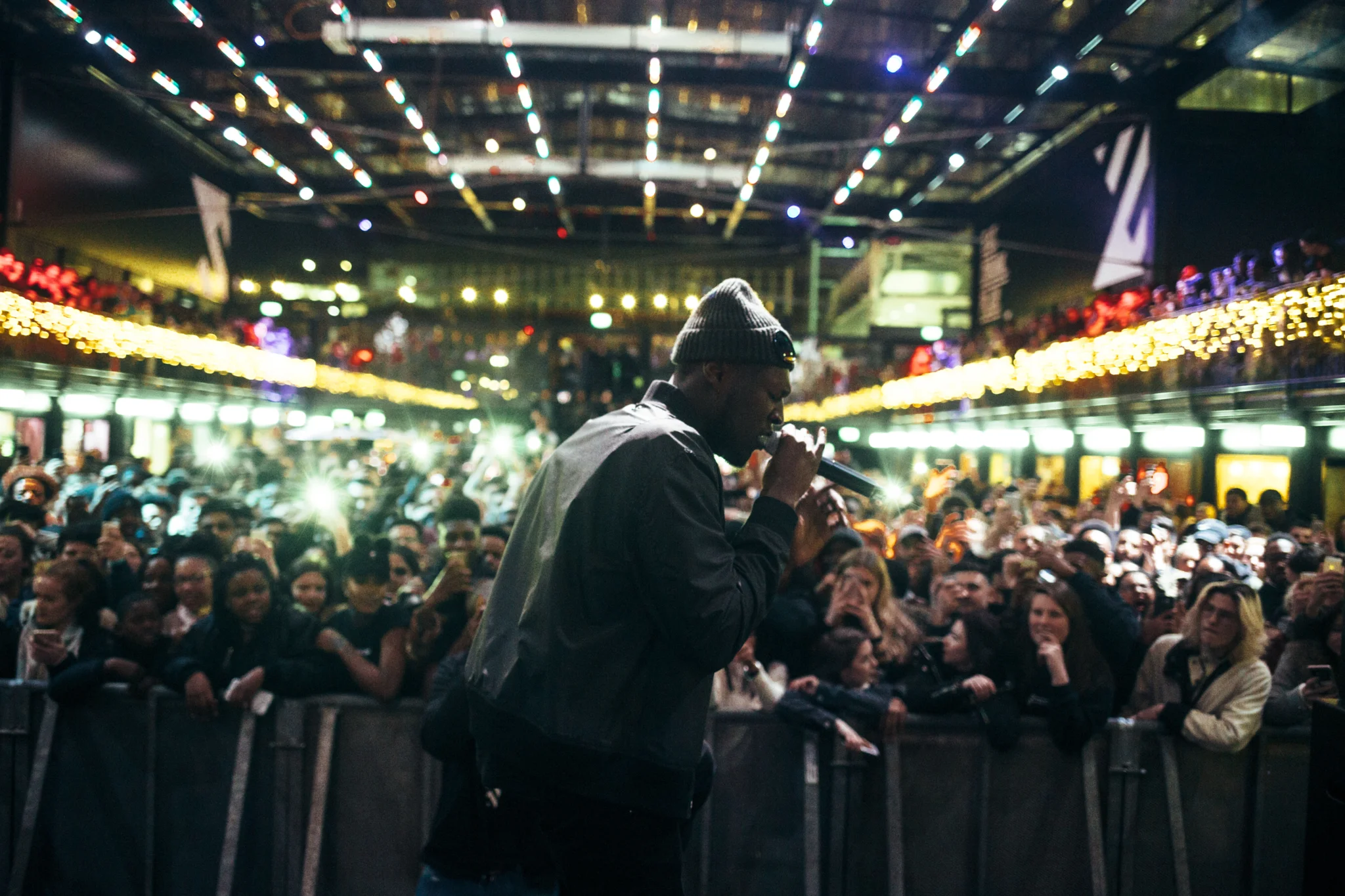 Stormzy performing to an audience