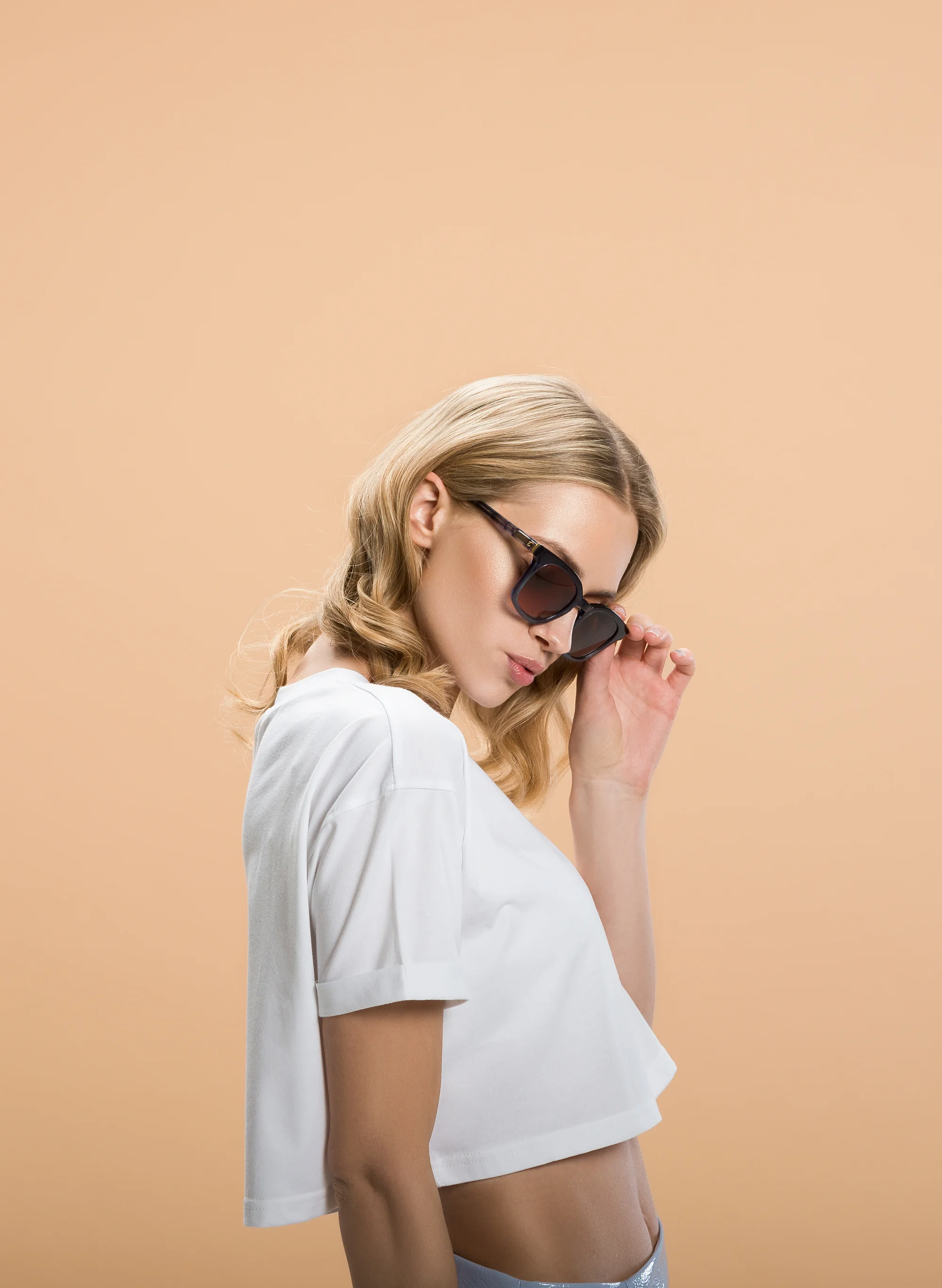 Thumbnail of woman modelling Tens Sunglasses used for Tens website design by Superrb