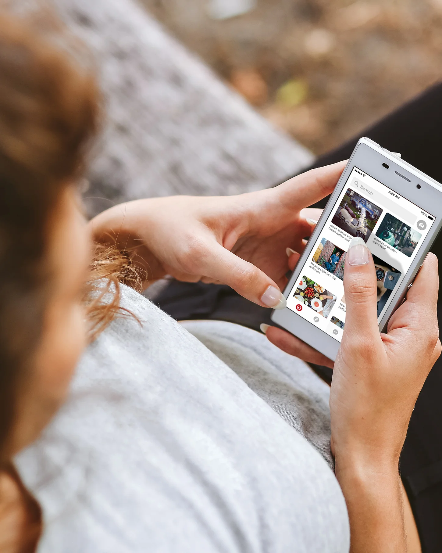 Thumbnail of a woman using Pinterest on her smartphone