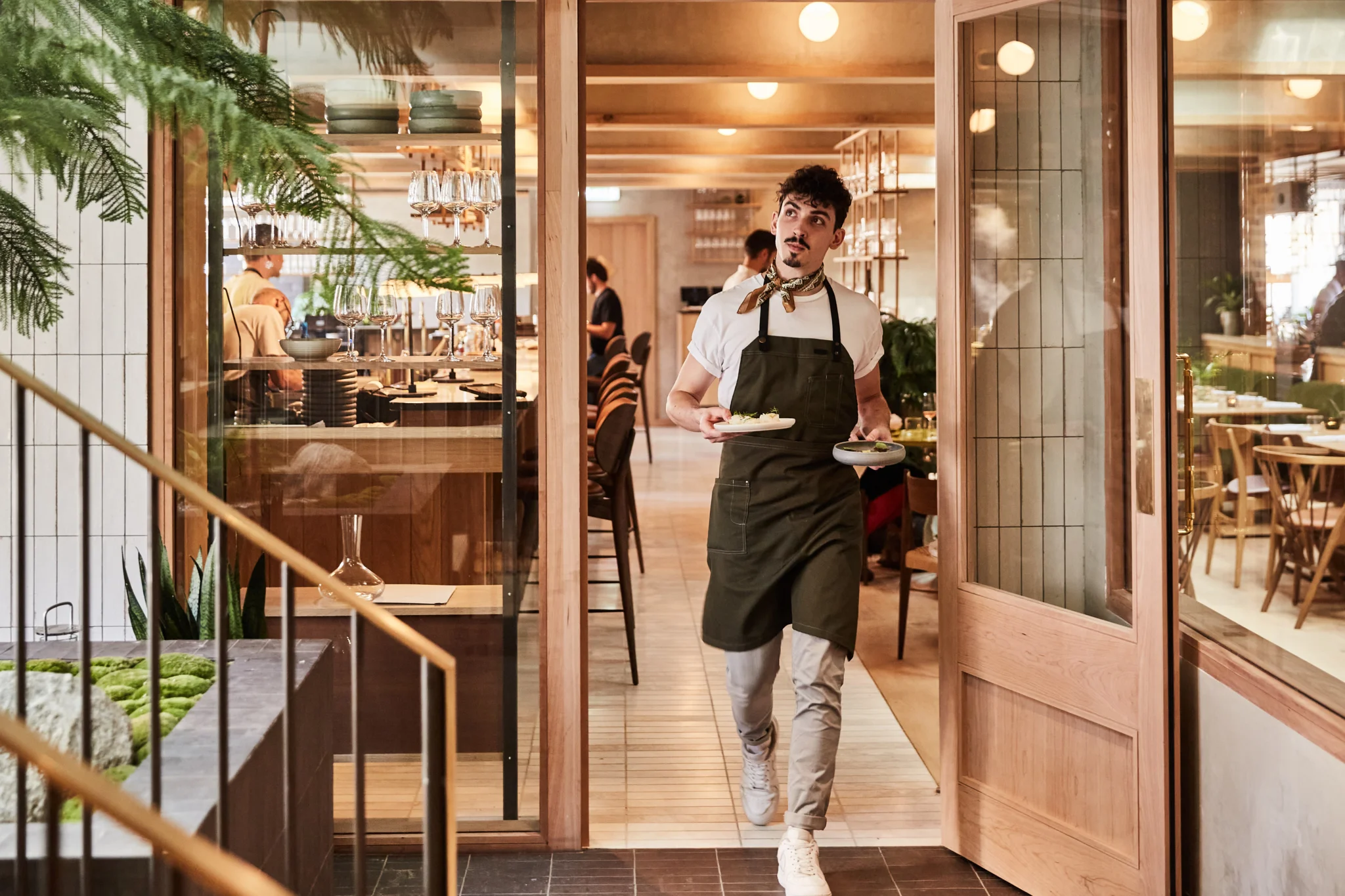 Waiter walking through Eldr Restaurant at Pantechnicon